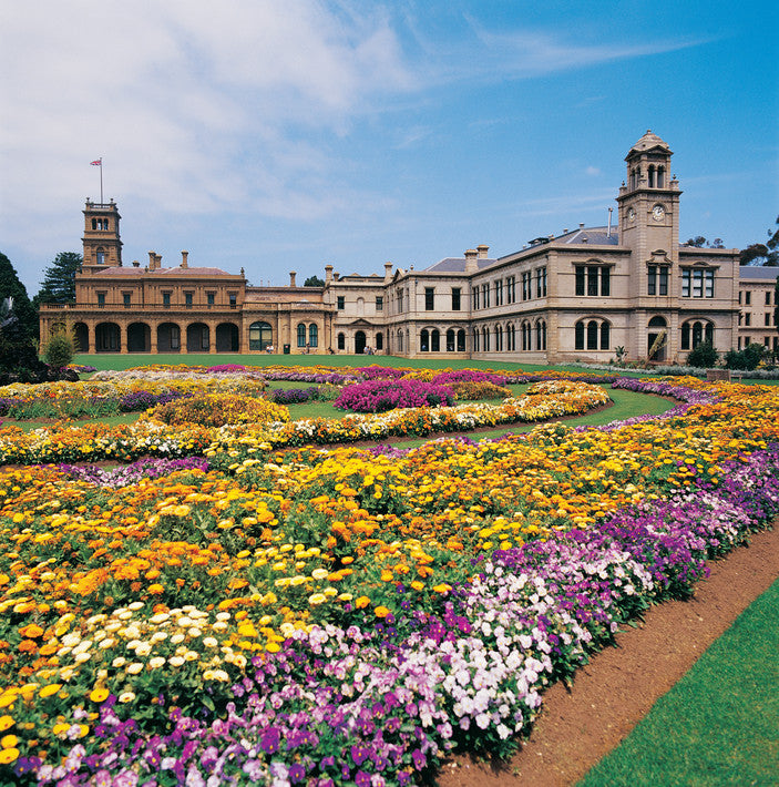 Historic building with a flower garden in front at the Melbourne international flower and garden show 2026